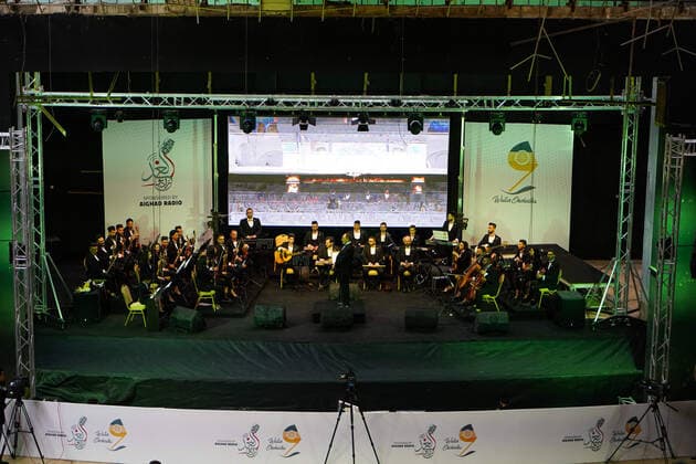 April 8, 2021, Mosul, Nineveh, Iraq: Members of the Watar orchestra playing for the first time on the grounds of the Spring Theatre Hall, which was destroyed during the ISIS occupation in the city..The Watar orchestral includes 36 young men and women from different denominations of Nineveh Governorate, including Muslims, Christians and Yazidis, whose ages range between 8-32 years. Mosul Iraq - ZUMAs197 20210408_zaa_s197_165 Copyright: xIsmaelxAdnanx