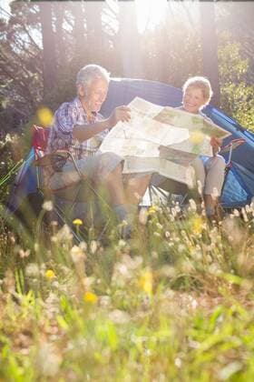 Senior couple studying the map Senior couple studying the map on a camping trip, model released, Cape Town, South Africa, 09.02.2016, 733834.jpg, retirement, golden years, retired, senior couple, tent, green, forest, tree, countryside, adventure, outside, trip, vacations, outdoor, adventuring, adventurer, hiking, fit, healthy, nature, environment, activity, recreation, leisure, lifestyle, exploration, weekends, weekend activities, hiker, casual clothing, camping, happy, smiling, cheerful, standing, couple, relationship, together, map, studying, reading, holding, way, direction