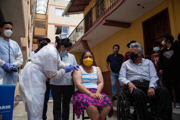 News Bilder des Tages April 9, 2021, Quito, Pichincha, Ecuador: A nurse administers the Pfizer COVID19 Vaccine to Carmita Quichuela, a woman with Intellectual Disability (ID) during the first phase of Covid19 vaccination in Quito..The first phase of COVID19 Vaccination in Ecuador has been carried out starting with persons with disabilities. This vaccination program is designed to reach their homes, on this occasion the beneficiary was Camita Quichuela, a 41-year-old woman who has 80% intellectual disability (ID) and is totally dependent on the care of her mother. The President of Ecuador Lenin Moreno was present at the event. Quito Ecuador - ZUMAs197 20210409_zaa_s197_282 Copyright: xJuanxDiegoxMontenegrox