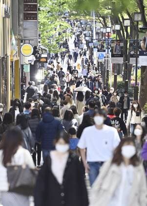 Japan s fight against novel coronavirus People wearing masks to protect against the novel coronavirus walk in Tokyo s Omotesando area on April 10, 2021, the first Saturday after the Japanese government designated Tokyo and Kyoto and Okinawa prefectures as requiring stronger measures to fight COVID-19. 