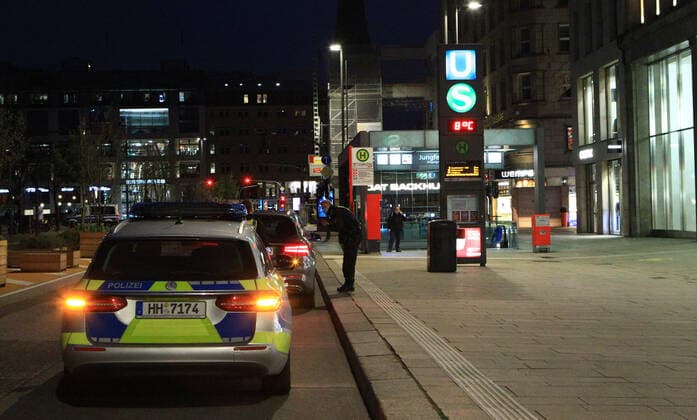 Police control at Hamburg Jungfernstieg after the beginning of the curfew at 21 oclock Altstadt Hamburg