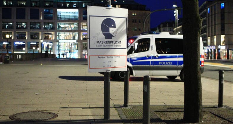 A police patrol car is parked at Hamburgs Jungfernstieg after the curfew began at 9 p.m. Altstadt Hamburg