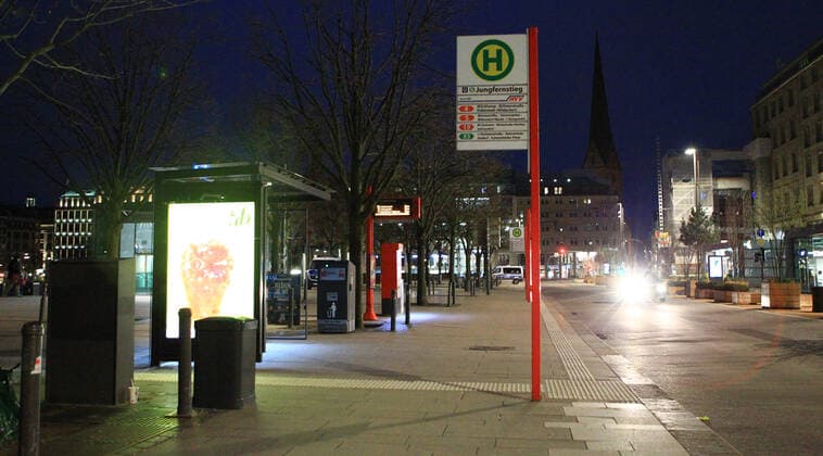 Empty bus stop Jungfernstieg after the curfew started at 9 pm Altstadt Hamburg