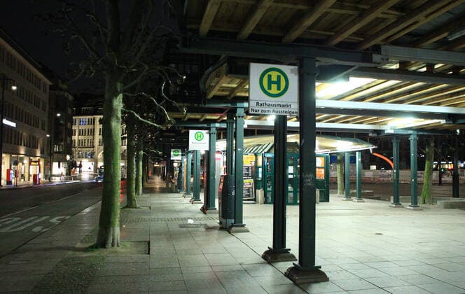 Empty bus stop Rathausmarkt after the beginning of the curfew at 21 oclock Old Town Hamburg