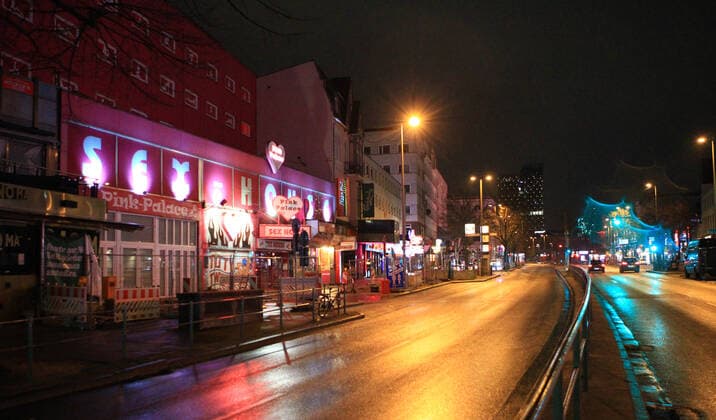 Empty street Reeperbahn on St Pauli after the beginning of the curfew at 21 oclock Altona Hamburg