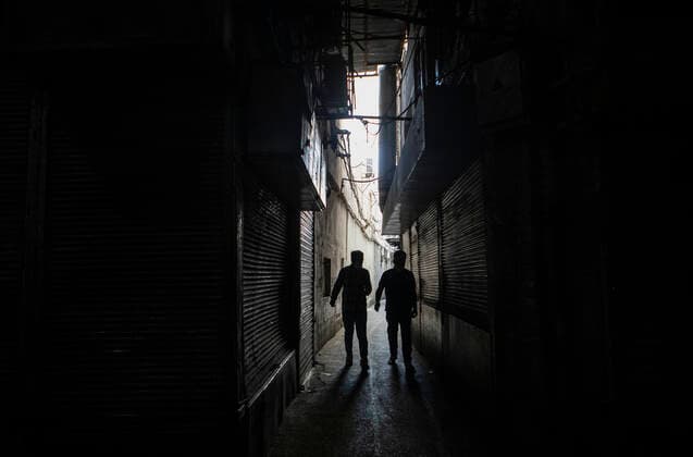 (210410) -- TEHRAN, April 10, 2021 -- People walk past closed shops at the Grand Bazaar in Tehran, Iran, April 10, 2021. Iran on Saturday enforced a 10-day restriction throughout the country to curb the recent resurgence of coronavirus cases and deaths. (Photo by Xinhua) IRAN-TEHRAN-COVID-19-NATIONWIDE RESTRICTIONS-IMPOSED AhmadxHalabisaz 