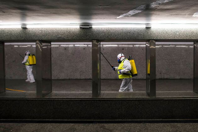 April 11, 2021, Warsaw, Poland: Cleaning service workers are seen disinfecting one of the most frequently used underpass in Warsaw..At night, the municipal cleaning services disinfect the most important and most frequently used communication routes in the center of Warsaw. Disinfection was carried out with highly ozonated water - it is an innovative Polish method..Disinfection of Warsaw was performed due to the covid 19 pandemic, the third wave of the virus is currently raging in Poland, there is a shortage of places in hospitals and the average daily number of new cases is around 30,000, while deaths are over 600. Warsaw Poland - ZUMAs197 20210411_zaa_s197_009 Copyright: xAttilaxHusejnowx