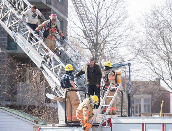 April 11, 2021, Montreal, PQ, Canada: Firefighters help people out of an apartment building following a fire in Montreal, Sunday, April 11, 2021. Montreal Canada  - ZUMAc35_ 20210411_zaf_c35_007 Copyright: xGrahamxHughesx