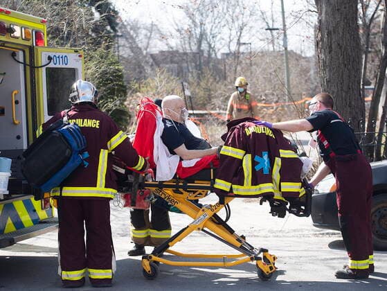 April 11, 2021, Montreal, PQ, Canada: A man is placed into an ambulance following a fire at an apartment building in Montreal, Sunday, April 11, 2021. Montreal Canada  - ZUMAc35_ 20210411_zaf_c35_009 Copyright: xGrahamxHughesx