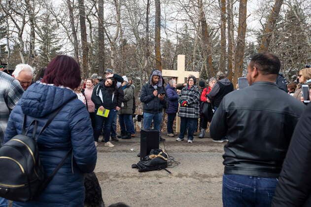 April 11, 2021, EDMONTON, ab, Canada: A supporter gives a sermon outside GraceLife Church near Edmonton, Alta., on Sunday, April 11, 2021. The church has been fenced off by police and Alberta Health Services in violation of COVID-19 rules. EDMONTON Canada  - ZUMAc35_ 20210411_zaf_c35_041 Copyright: xJasonxFransonx