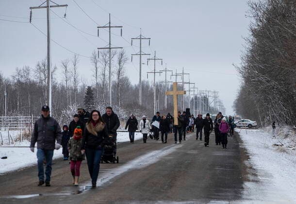 April 11, 2021, Spruce Grove, ab, Canada: GraceLife Church supporters carry a cross down the road as they gather in Spruce Grove near Edmonton Alta, on Sunday April 11, 2021. The church has been fenced off by police and Alberta Health Services in violation of COVID-19 rules. Spruce Grove Canada  - ZUMAc35_ 20210411_zaf_c35_054 Copyright: xJasonxFransonx