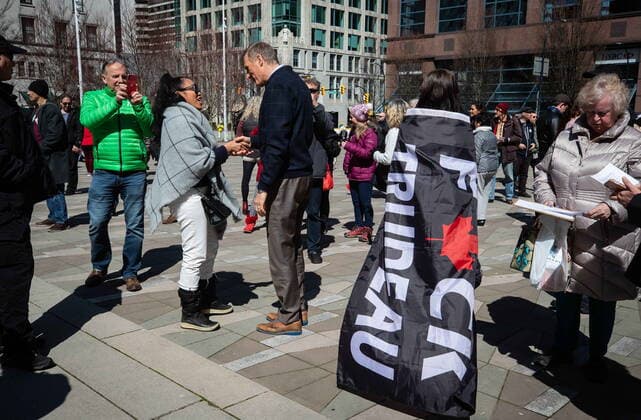 April 11, 2021, Vancouver, BC, Canada: People s Party Leader Maxime Bernier, centre left, shakes hands with a supporter during an Open Up Canada rally and march held by people opposed to public health guidelines in place to curb the spread of COVID-19, in Vancouver, on Sunday, April 11, 2021. Vancouver Canada - ZUMAc35_ 20210411_zaf_c35_061 Copyright: xDarrylxDyckx