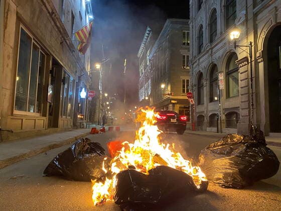 April 11, 2021, Montreal, PQ, Canada: People take part in an anti-curfew protest in Montreal on Sunday April 11, 2021. Hundreds of people gathered in Old Montreal tonight in defiance of a new 8 p.m. curfew. Montreal Canada  - ZUMAc35_ 20210411_zaf_c35_066 Copyright: xGiuseppexValiantex