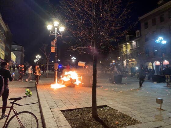 April 11, 2021, Montreal, PQ, Canada: People take part in an anti-curfew protest in Montreal on Sunday April 11, 2021. Hundreds of people gathered in Old Montreal tonight in defiance of a new 8 p.m. curfew. Montreal Canada  - ZUMAc35_ 20210411_zaf_c35_069 Copyright: xGiuseppexValiantex