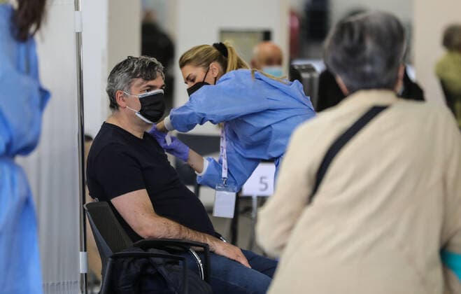 PXL_Mass vaccination in Zagreb A member of the medical staff vaccinates a patient during a mass vaccination at Zagreb Fair hall in Zagreb,Croatia on April 12, 2021.By the end of the day 5,000 citizens should receive the AstraZeneca COVID-19 vaccine JuricaxGaloic PIXSELL