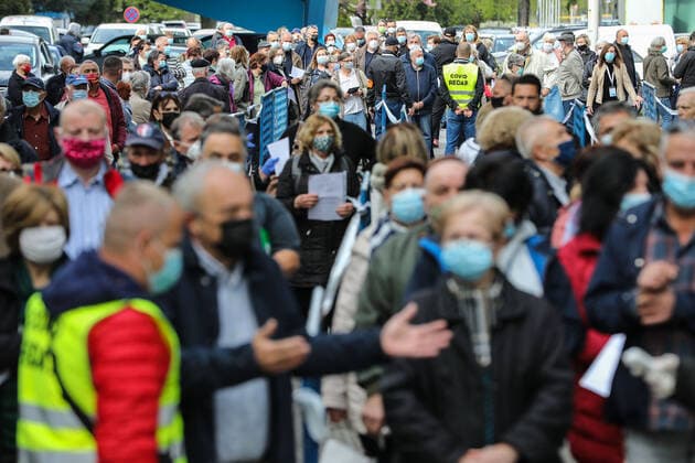 PXL_Mass vaccination in Zagreb People queue outside Zagreb Fair hall during a mass vaccination at Zagreb Fair hall in Zagreb,Croatia on April 12, 2021.By the end of the day 5,000 citizens should receive the AstraZeneca COVID-19 vaccine JuricaxGaloic PIXSELL