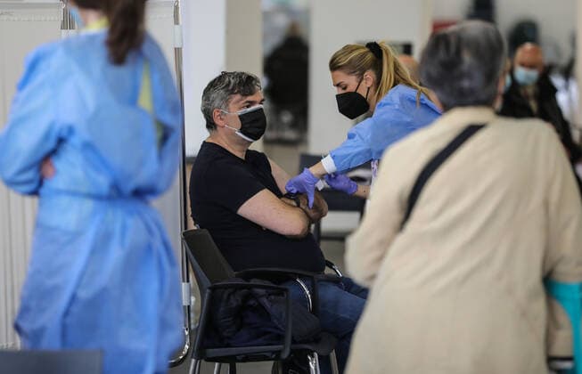 PXL_Mass vaccination in Zagreb A member of the medical staff vaccinates a patient during a mass vaccination at Zagreb Fair hall in Zagreb,Croatia on April 12, 2021.By the end of the day 5,000 citizens should receive the AstraZeneca COVID-19 vaccine JuricaxGaloic PIXSELL