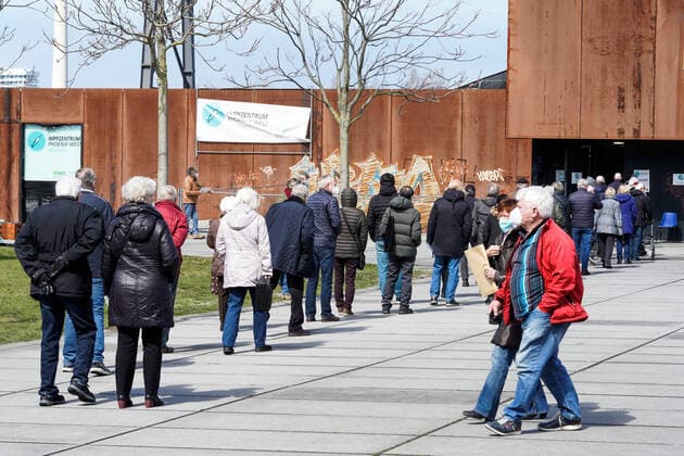 Dortmunjd, 12 04 2021 Queue in front of the Corona Vaccination Centre in the Warsteiner Music Hall on the site of the former Hoesch blast furnace plant Phoenix West in the Dortmund district of Hörde The vaccinations are carried out here by the Kassenärztliche Vereinigung Westfalen Lippe KVWL