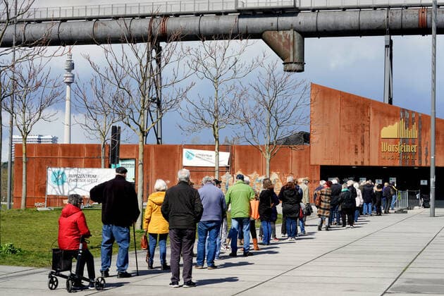 Dortmunjd, 12 04 2021 Queue in front of the Corona Vaccination Centre in the Warsteiner Music Hall on the site of the former Hoesch blast furnace plant Phoenix West in the Dortmund district of Hörde The vaccinations are carried out here by the Kassenärztliche Vereinigung Westfalen Lippe KVWL