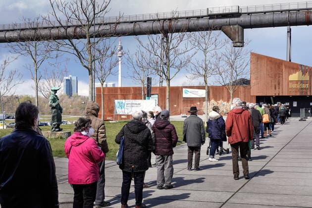 Dortmunjd, 12 04 2021 Queue in front of the Corona Vaccination Centre in the Warsteiner Music Hall on the site of the former Hoesch blast furnace plant Phoenix West in the Dortmund district of Hörde The vaccinations are carried out here by the Kassenärztliche Vereinigung Westfalen Lippe KVWL