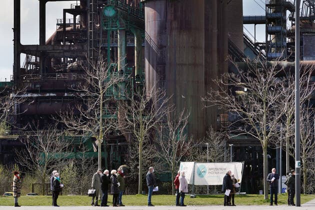 Dortmunjd, 12 04 2021 Queue in front of the Corona Vaccination Centre in the Warsteiner Music Hall on the site of the former Hoesch blast furnace plant Phoenix West in the Dortmund district of Hörde The vaccinations are carried out here by the Kassenärztliche Vereinigung Westfalen Lippe KVWL