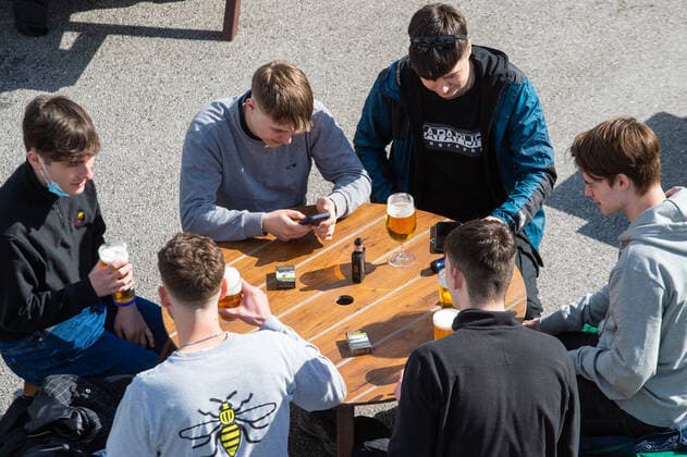 Young men drinking in the beer garden at the JD Wetherspoon Gateway pub in East Didsbury, south Manchester on 12 April 2021. Customers have returned to the High Street on Monday as non-essential retailers in England and Wales reopened after more than three months of lockdown restrictions due to the Covid-19 pandemic. Manchester Greater Manchester England City centre  Copyright: xMattxWilkinsonx