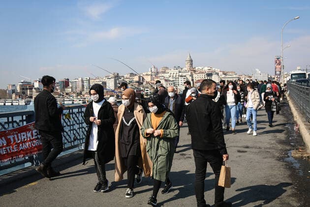 April 12, 2021, Istanbul, Turkey: People wearing masks are seen walking on the Galata Bridge in Eminonu, Istanbul..President Erdogan is expected to announce the new coronavirus measures to be implemented during the month of Ramadan which is starting tomorrow. Istanbul Turkey - ZUMAs197 20210412_zab_s197_046 Copyright: xHakanxAkgunx