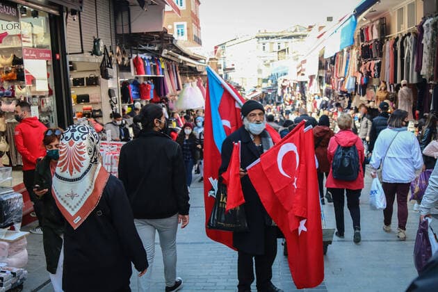 April 12, 2021, Istanbul, Turkey: A man is selling a Turkish flag in Eminonu, Istanbul..President Erdogan is expected to announce the new coronavirus measures to be implemented during the month of Ramadan which is starting tomorrow. Istanbul Turkey - ZUMAs197 20210412_zab_s197_051 Copyright: xHakanxAkgunx