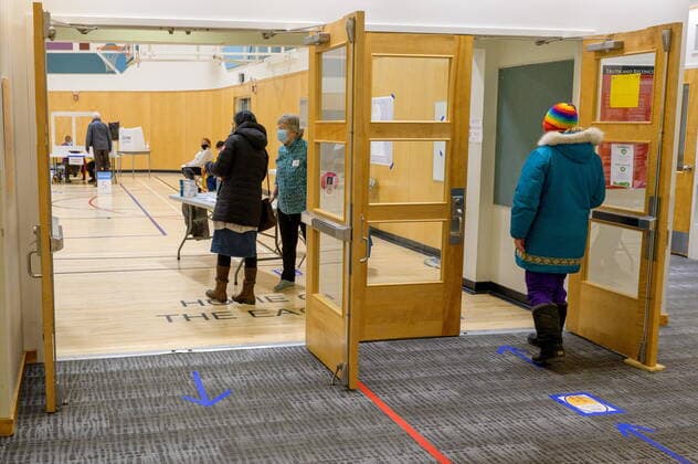 April 12, 2021: A voter lines up to enter to their cast ballot at a Whitehorse polling station during the Yukon election on Monday April 12, 2021. Polls have opened across Yukon as the Liberal government led by Sandy Silver seeks a second term.  - ZUMAc35_ 20210412_zaf_c35_050 Copyright: xMarkxKellyx