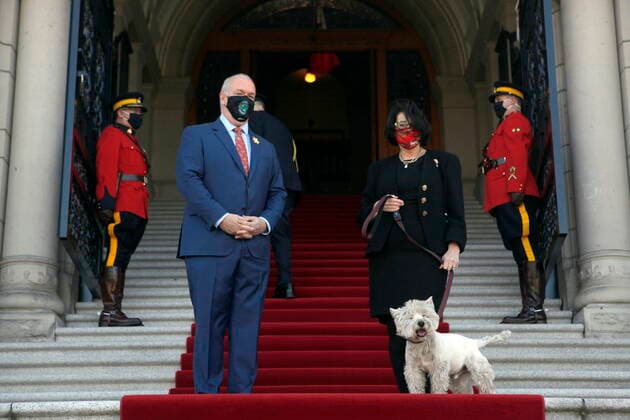April 12, 2021, Victoria, BC, Canada: Premier John Horgan meets with Lt.- Gov. Janet Austin and her dog Macduff on the steps of B.C. Legislature before delivering the throne speech at Legislature in Victoria, B.C., on Monday, April 12, 2021. Victoria Canada  - ZUMAc35_ 20210412_zaf_c35_073 Copyright: xChadxHipolitox