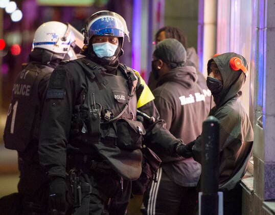 April 12, 2021, Montreal, PQ, Canada: Police detain people as anti-curfew protests continue for a second night Monday, April 12, 2021 in Montreal. Montreal Canada  - ZUMAc35_ 20210412_zaf_c35_098 Copyright: xRyanxRemiorzx