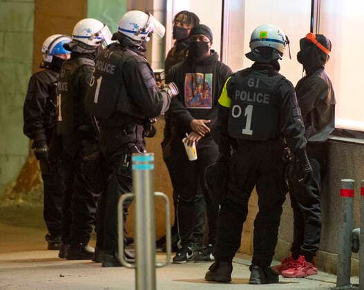 April 12, 2021, Montreal, PQ, Canada: Police detain people as anti-curfew protests continue for a second night Monday, April 12, 2021 in Montreal. Montreal Canada  - ZUMAc35_ 20210412_zaf_c35_099 Copyright: xRyanxRemiorzx