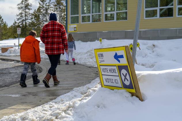April 12, 2021: A voter and children arrive at a Whitehorse polling station during the Yukon election on Monday April 12, 2021. Polls have closed across Yukon and votes are being counted as three main parties vie to form the territory s next government.  - ZUMAc35_ 20210412_zaf_c35_112 Copyright: xMarkxKellyx