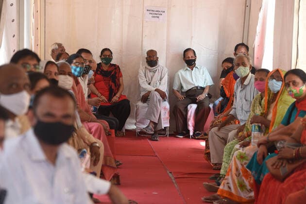 NEW DELHI, INDIA - APRIL 12: People wait in queue to get vaccinated against Covid-19, on the second day of Tika Utsav , at Rajiv Gandhi Super Specialty Hospital, on April 12, 2021 in New Delhi, India. (Photo by Raj K Raj Hindustan Times) Over 40 lakh People Vaccinated On Second Day Of Tika Utsav