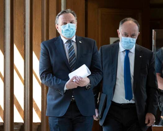 April 13, 2021, QUEBEC, PQ, Canada: Quebec Premier Francois Legault, left, and Quebec Health Minister Christian Dube walk to a news conference on the COVID-19 pandemic, Tuesday, April 13, 2021 at the legislature in Quebec City. QUEBEC Canada  - ZUMAc35_ 20210413_zaf_c35_043 Copyright: xJacquesxBoissinotx