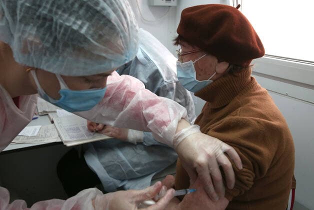SEVASTOPOL, RUSSIA â€“ APRIL 14, 2021: A woman receives the Gam-COVID-Vac vaccine (under the brand name of Sputnik V) at a mobile COVID-19 vaccination unit. Since the start of the pandemic, Sevastopol has confirmed more than 13,694 cases of COVID-19. Since mid-March, the number of new confirmed cases has been increasing in Sevastopol by more than 30 daily. Sergei Malgavko TASS  TS0FCB30