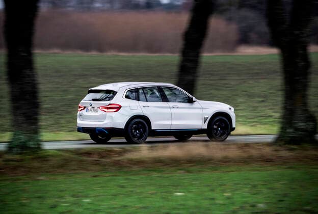 BMW iX3 Charged driving on the road. STOCKHOLM SWEDEN x10050x *** BMW iX3 Charged driving on the road STOCKHOLM SWEDEN x10050x,  Copyright: xPontusxLundahl TTx BMW IX3 CHARGED