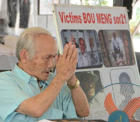 February 13, 2017, Phnom Penh, Cambodia: Vice Media has admitted to digitally altering photos of prisoners held by the Khmer Rouge at the infamous Tuol Sleng or S-21 prison in Phnom Penh, Cambodia. Some of the photos were colorized by Vice and edited to show victims smiling. BOU MENG, a survivor of the prison, a former high school, is shown Tuesday, February 13, 2017, signing books for visitors to the site. Phnom Penh Cambodia - ZUMAh154 20170213_znp_h154_002 Copyright: xMarkxHertzbergx