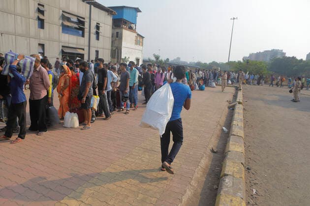 April 14, 2021, Mumbai, Maharshtra, INDIA: 14 April 2021 - Mumbai - INDIA..A migrant worker with luggage arrive at the Lokmanya Tilak Train station in an attempt to take a train to his village..Migrants in their thousands are Fleeing out of Mumbai & other big cities of INDIA back to their Villages in fear of a Total Lock down..Migrants fear a repeat of the events of last year when many had a tortuous experience when they tracked about 1500 kms back to their villages on FOOT when the 1st lock down was announced. Mumbai INDIA - ZUMAsu5_ 20210414_zap_su5_014 Copyright: xSubhashxSharmax