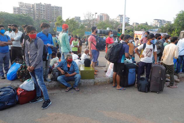 April 14, 2021, Mumbai, Maharshtra, INDIA: 14 April 2021 - Mumbai - INDIA..Migrant workers camp outside the Lokmanya Tilak Train station in an attempt to take a train to his village..Migrants in their thousands are Fleeing out of Mumbai & other big cities of INDIA back to their Villages in fear of a Total Lock down..Migrants fear a repeat of the events of last year when many had a tortuous experience when they tracked about 1500 kms back to their villages on FOOT when the 1st lock down was announced. Mumbai INDIA - ZUMAsu5_ 20210414_zap_su5_021 Copyright: xSubhashxSharmax