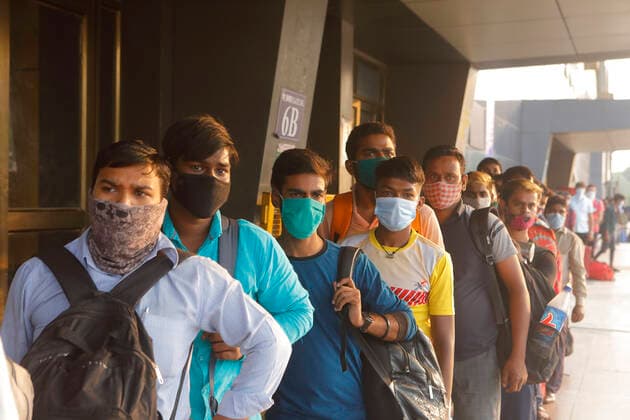 April 14, 2021, Mumbai, Maharshtra, INDIA: 14 April 2021 - Mumbai - INDIA..Migrant workers queue up outside the Lokmanya Tilak Train station to flee to their villages in fear of a Lock down..Migrants in their thousands are Fleeing out of Mumbai & other big cities of INDIA back to their Villages in fear of a Total Lock down..Migrants fear a repeat of the events of last year when many had a tortuous experience when they tracked about 1500 kms back to their villages on FOOT when the 1st lock down was announced. Mumbai INDIA - ZUMAsu5_ 20210414_zap_su5_022 Copyright: xSubhashxSharmax