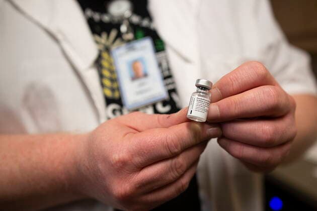 April 15, 2021, Saskatoon, SK, Canada: RN Jamie Tradewell holds up the Pfizer-BioNTech vaccine at the Saskatoon Tribal Council run vaccination clinic inside SaskTel centre in Saskatoon, Sask., on Thursday, April 15, 2021. Saskatoon Canada  - ZUMAc35_ 20210415_zaf_c35_070 Copyright: xKaylexNeisx