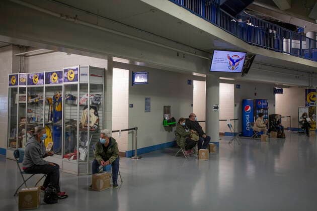 April 15, 2021, Saskatoon, SK, Canada: Patients wait after receiving their vaccines at the Saskatoon Tribal Council run vaccination clinic inside SaskTel centre in Saskatoon, Sask., on Thursday, April 15, 2021. Saskatoon Canada  - ZUMAc35_ 20210415_zaf_c35_071 Copyright: xKaylexNeisx