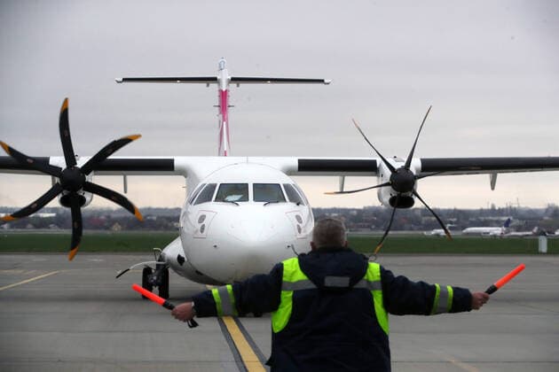 KYIV, UKRAINE - APRIL 16, 2021 - An aircraft marshaller signals an aeroplane that delivered the first batch of the Pfizer?BioNTech COVID-19 vaccine (Comirnaty) at Kyiv International Airport, Kyiv, capital of Ukraine. The first batch of the Pfizer?BioNTech vaccine that contains 117,000 doses is intended for the residents of care homes and the employees of the State Emergency Service and the State Border Guard Service. Ukraine gets first batch of Pfizer vaccine  Copyright: xPavlo_Bagmutx