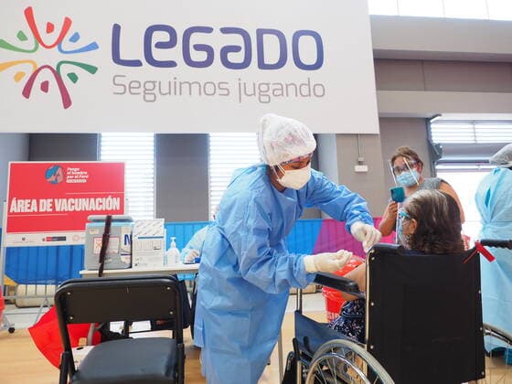 April 17, 2021, Lima, Lima, Peru: Elderly woman in a wheelchair being inoculated with the Covid-19 vaccine in a sports center. The Peruvian Government enabled the sports venues of the Lima 2019 Pan American Games as vaccination centers. Lima Peru - ZUMAg240 20210417_zip_g240_004 Copyright: xCarlosxGarciaxGranthonx