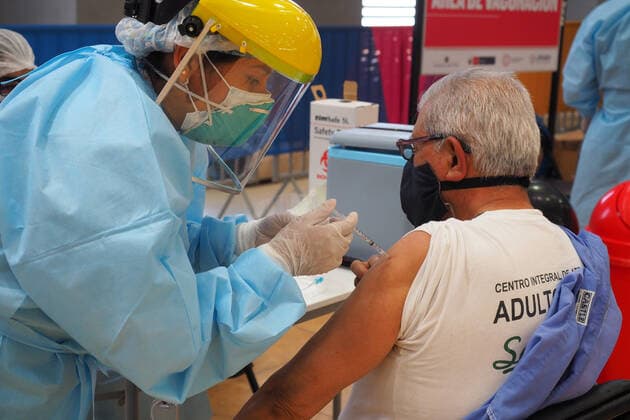 April 17, 2021, Lima, Lima, Peru: Elderly man being inoculated with the Covid-19 vaccine in a sports center. The Peruvian Government enabled the sports venues of the Lima 2019 Pan American Games as vaccination centers. Lima Peru - ZUMAg240 20210417_zip_g240_010 Copyright: xCarlosxGarciaxGranthonx