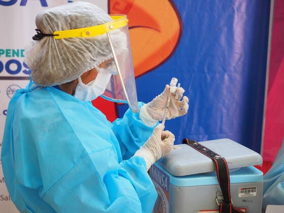 April 17, 2021, Lima, Lima, Peru: Medical personnel filling the hypodermic with the vaccine against covid-19 in a sports center. The Peruvian Government enabled the sports venues of the Lima 2019 Pan American Games as vaccination centers. Lima Peru - ZUMAg240 20210417_zip_g240_018 Copyright: xCarlosxGarciaxGranthonx