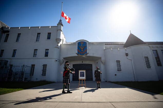 April 17, 2021, Vancouver, BC, Canada: Pipe Major Dan Bell, front left, plays the piper s lament in honour of Britain s Prince Philip as Regimental Sgt. Major Rob Deans, right, stands at attention while the Canadian flag flies at half mast outside The Seaforth Highlanders of Canada armoury in Vancouver, on Saturday, April 17, 2021. Prince Philip was the Colonel-in-Chief of The Seaforth Highlanders of Canada, an Army Reserve infantry regiment of 39 Canadian Brigade Group garrisoned in Vancouver. Vancouver Canada - ZUMAc35_ 20210417_zaf_c35_034 Copyright: xDarrylxDyckx