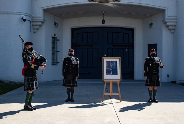 April 17, 2021, Vancouver, BC, Canada: Pipe Major Dan Bell, left, plays the piper s lament in honour of Britain s Prince Philip as Commanding Officer Lt. Col Ed Haverstock, second left, and Regimental Sgt. Major Rob Deans stand at attention outside The Seaforth Highlanders of Canada armoury in Vancouver, on Saturday, April 17, 2021. Prince Philip was the Colonel-in-Chief of The Seaforth Highlanders of Canada, an Army Reserve infantry regiment of 39 Canadian Brigade Group garrisoned in Vancouver. Vancouver Canada - ZUMAc35_ 20210417_zaf_c35_037 Copyright: xDarrylxDyckx