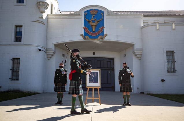 April 17, 2021, Vancouver, BC, Canada: Pipe Major Dan Bell, front, plays the piper s lament in honour of Britain s Prince Philip as Commanding Officer Lt. Col Ed Haverstock, back left, and Regimental Sgt. Major Rob Deans stand at attention outside The Seaforth Highlanders of Canada armoury in Vancouver, on Saturday, April 17, 2021. Prince Philip was the Colonel-in-Chief of The Seaforth Highlanders of Canada, an Army Reserve infantry regiment of 39 Canadian Brigade Group garrisoned in Vancouver. Vancouver Canada - ZUMAc35_ 20210417_zaf_c35_038 Copyright: xDarrylxDyckx